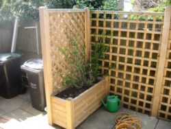 A bespoke planter made by Crestala with built in trellis