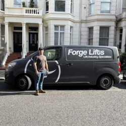 Forge Lifts engineer standing infront of van