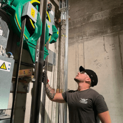 Lift engineer checking lift motor breaks.