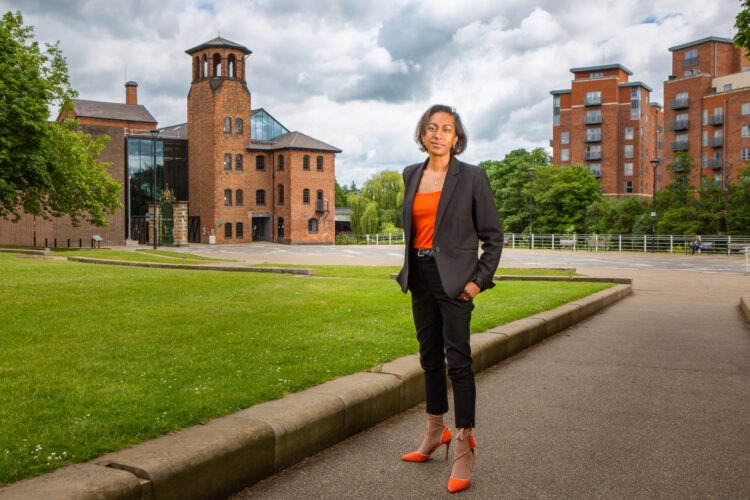 A full-length business image of a woman standing confidently in Derby City Centre