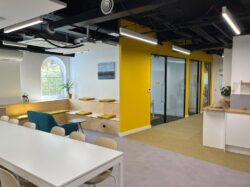 Office refurbishment breakout space with corporate branded colours.