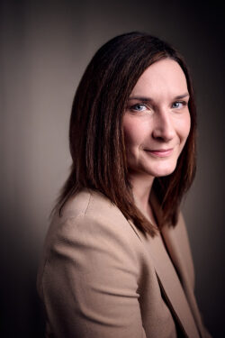 Woman in brown suit jacket