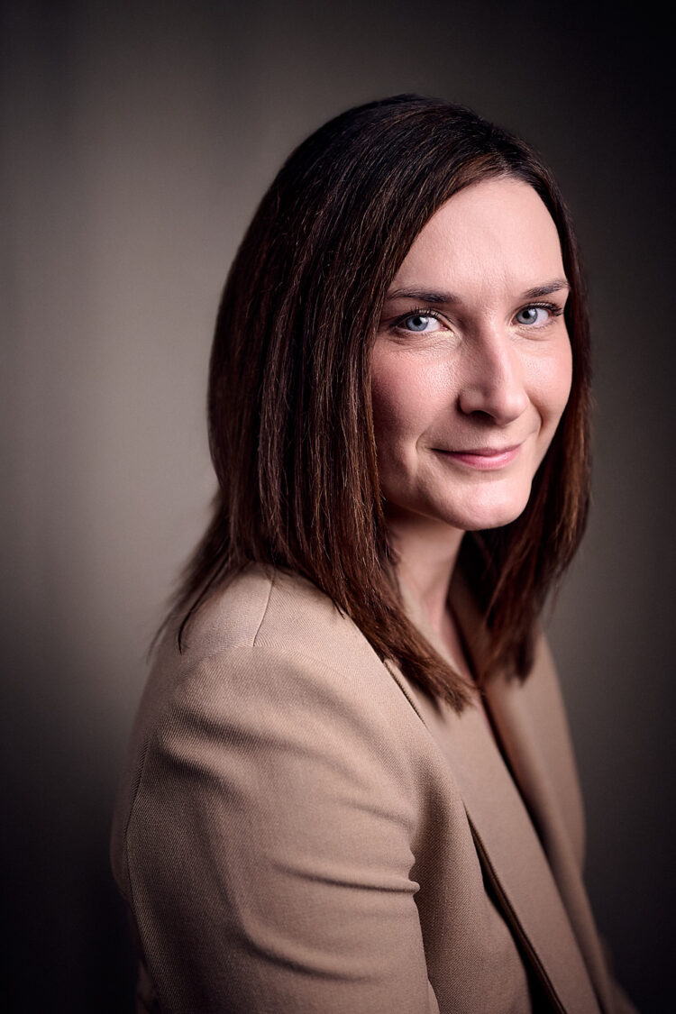 Woman in brown suit jacket