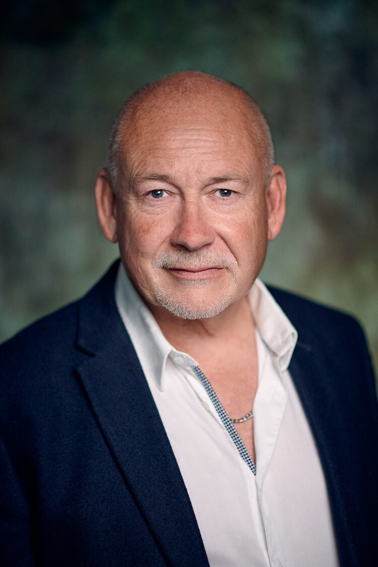 Nick McGowan posing for a headshot for Chris Henry Photography