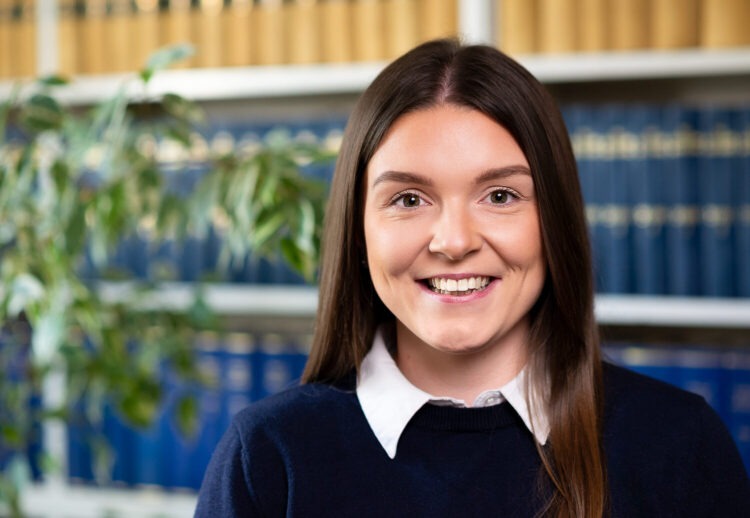 Corporate headshot of woman smiling at the camera