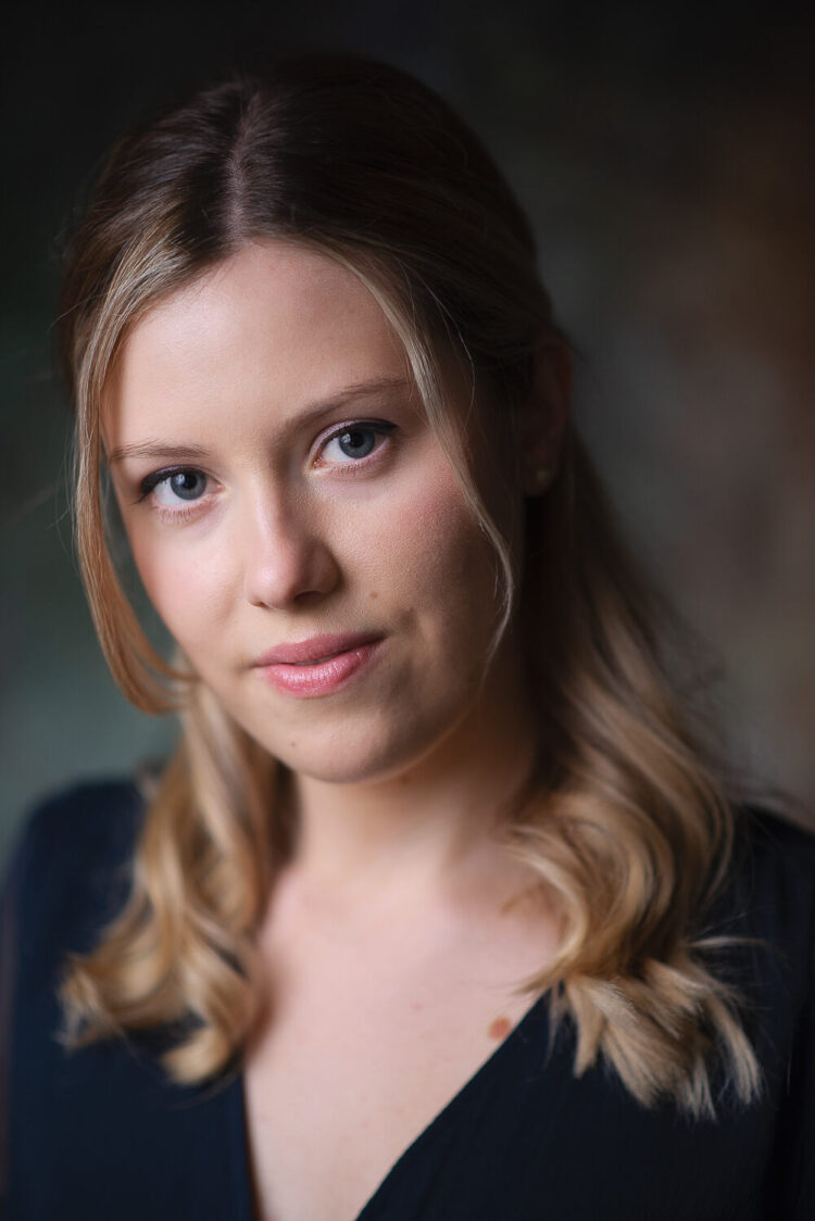 Headshot of blonde woman looking at the camera