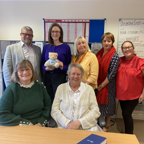 Lauren Edwards MP with the members of the Holding On Letting Go team