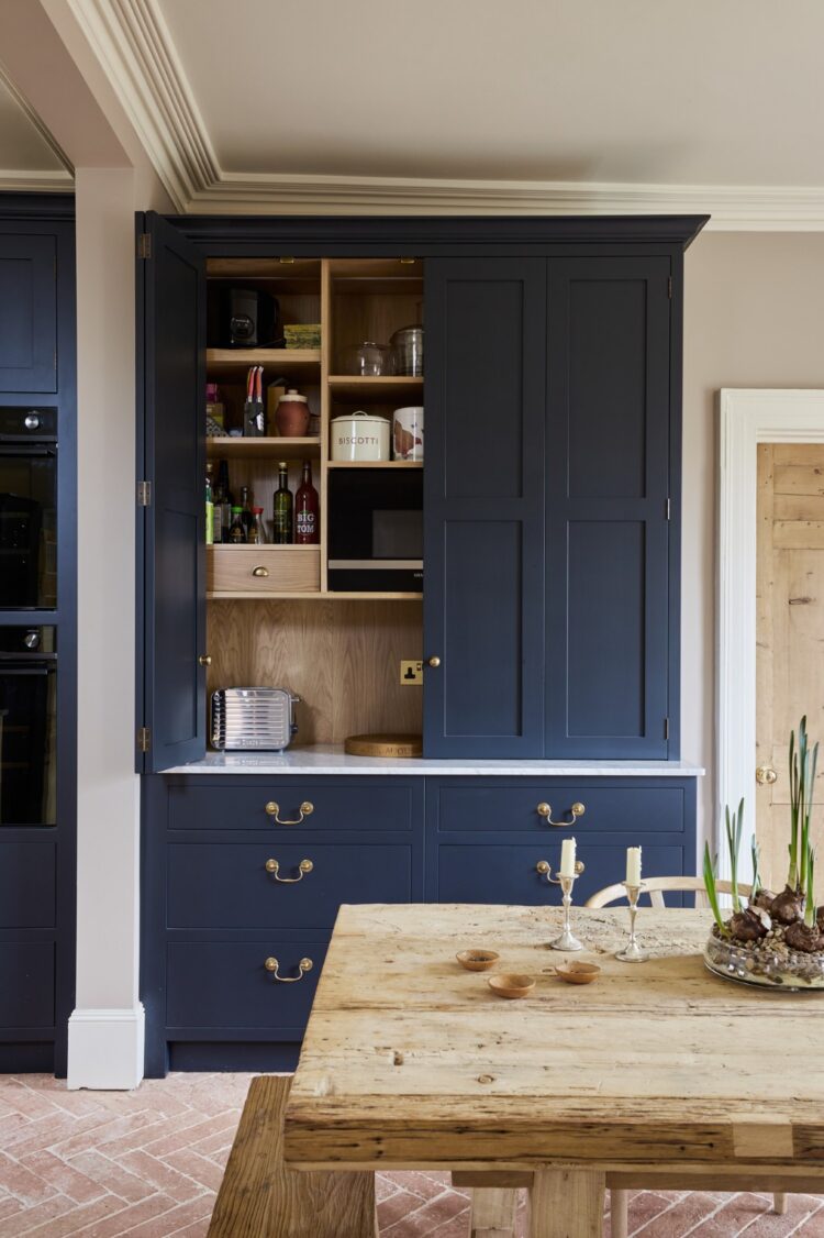 Bespoke dark blue painted dresser with oak shelving, integrated lighting and display storage, handcrafted by Collins Bespoke in Kent.