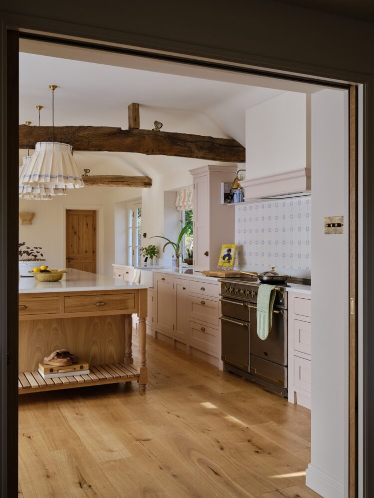 Handmade bespoke kitchen with painted cabinetry, natural wood details and a central island in a Paddock Wood home, Kent.